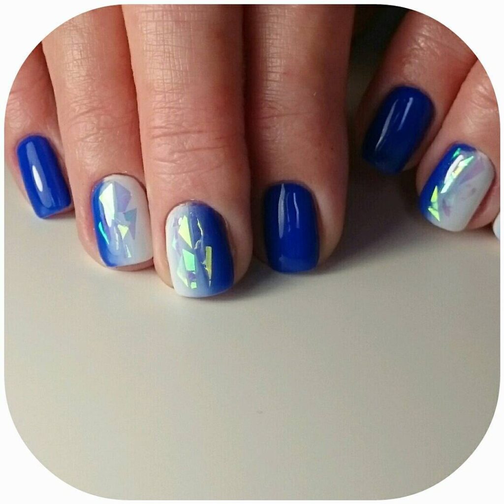 Nails divided with an iris motif in violet on one half and white on the other