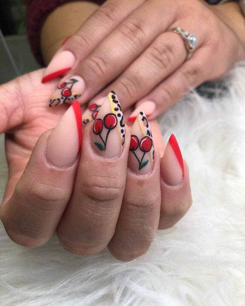 Square nails with black mountain designs and red or black fruit at peak.