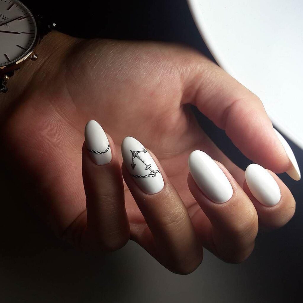 White almond nails with artistic designs