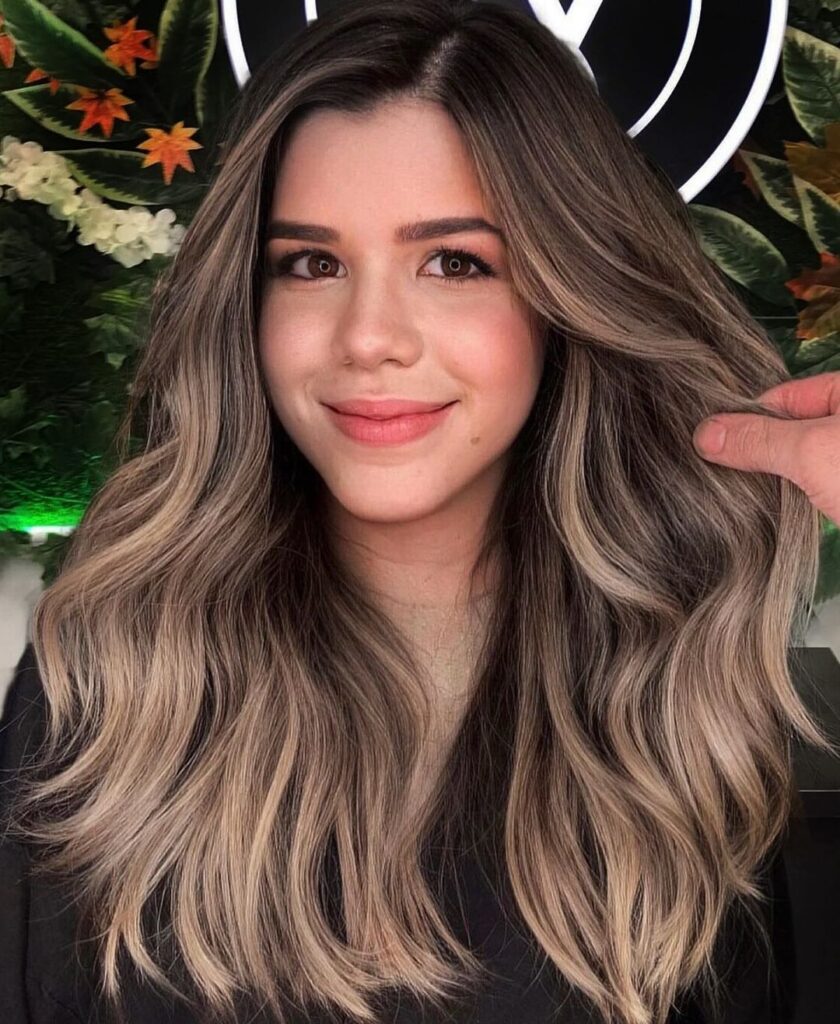 Wavy layered hair in beige-chocolate color
