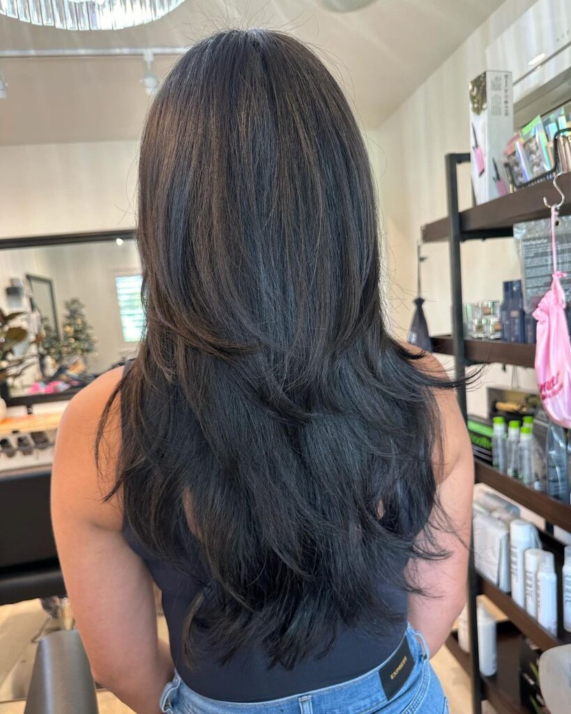 Voluminous layered hair with flowing ends