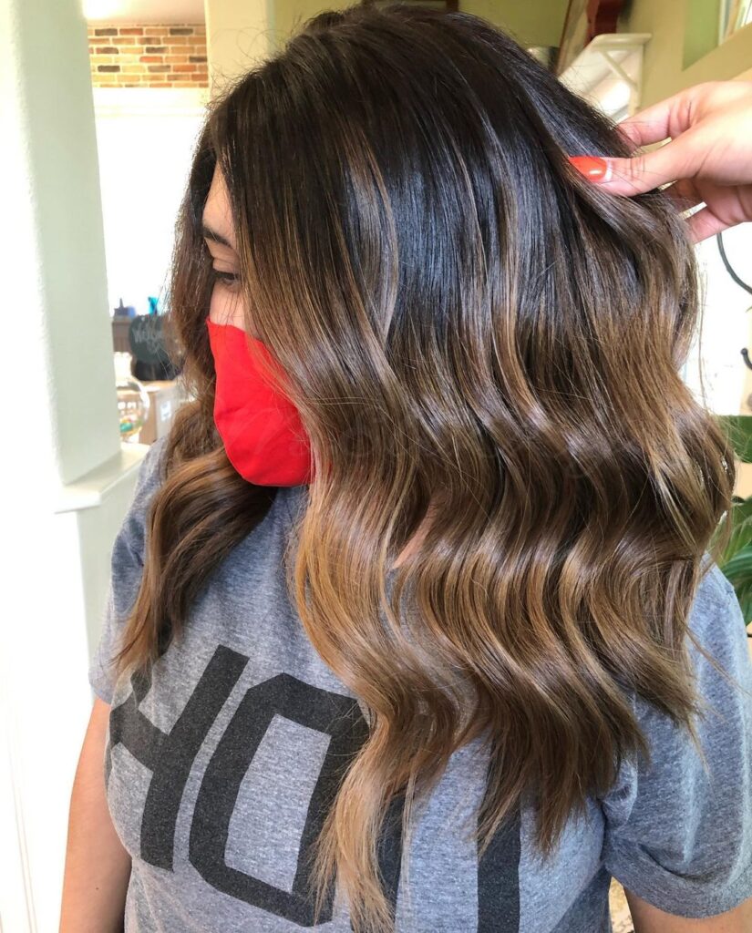 Dark hair with warm brown highlights