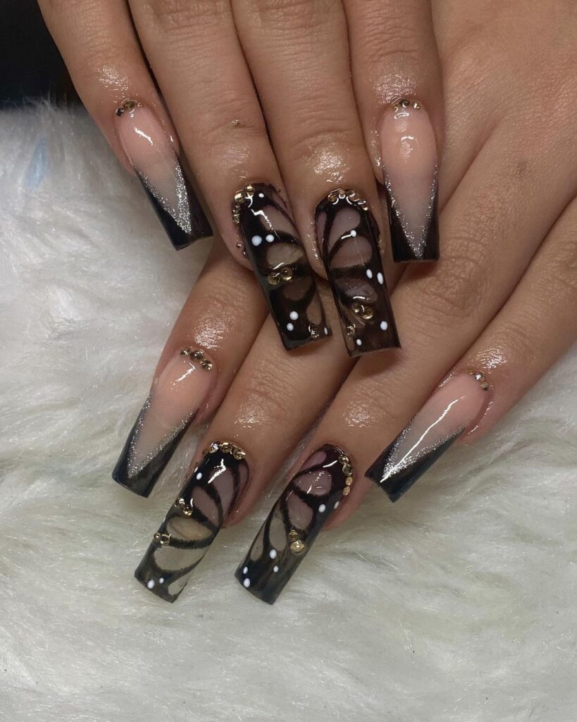 Square nails with black butterfly designs