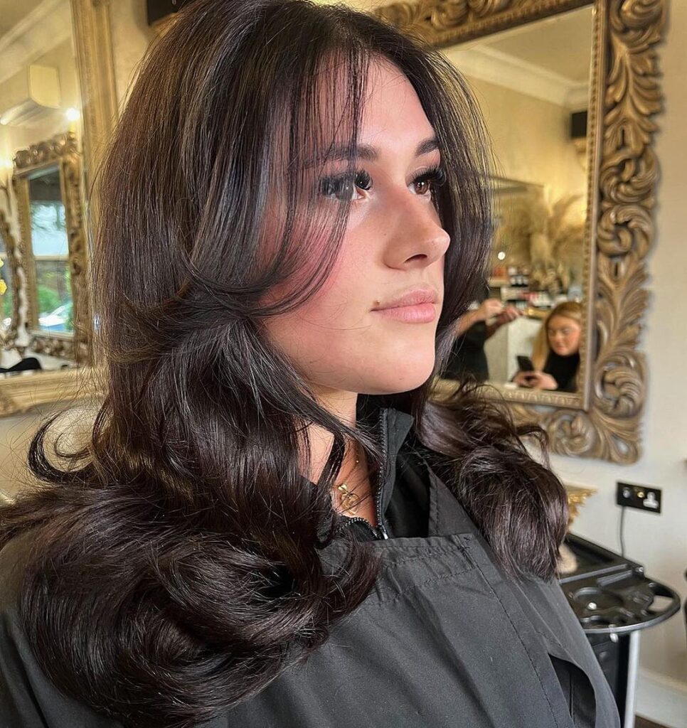 Voluminous curly brown hair, medium length