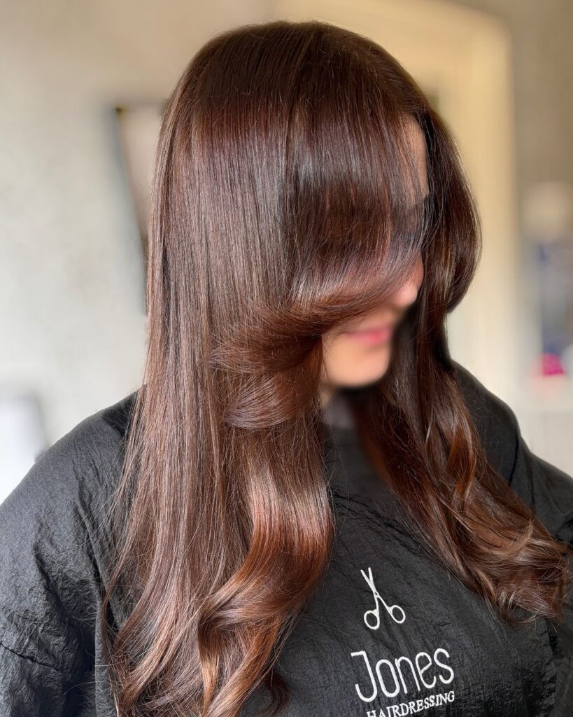 Voluminous wavy hair in chocolate brown