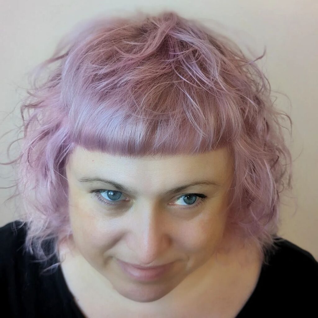 Mature woman with pink bowl-shaped shag