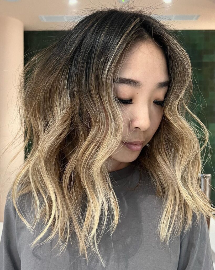 Blonde shoulder-length hair with textured layers