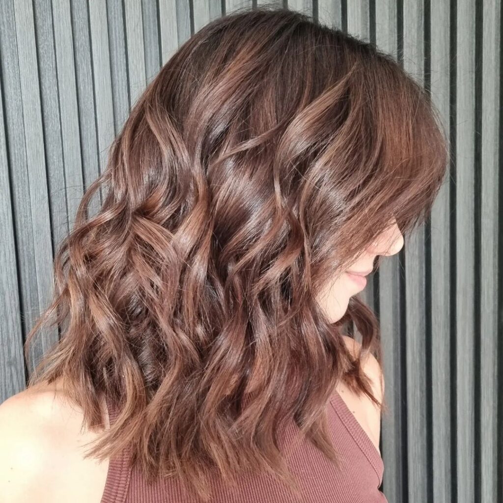 Dark brown hair with lighter streaks