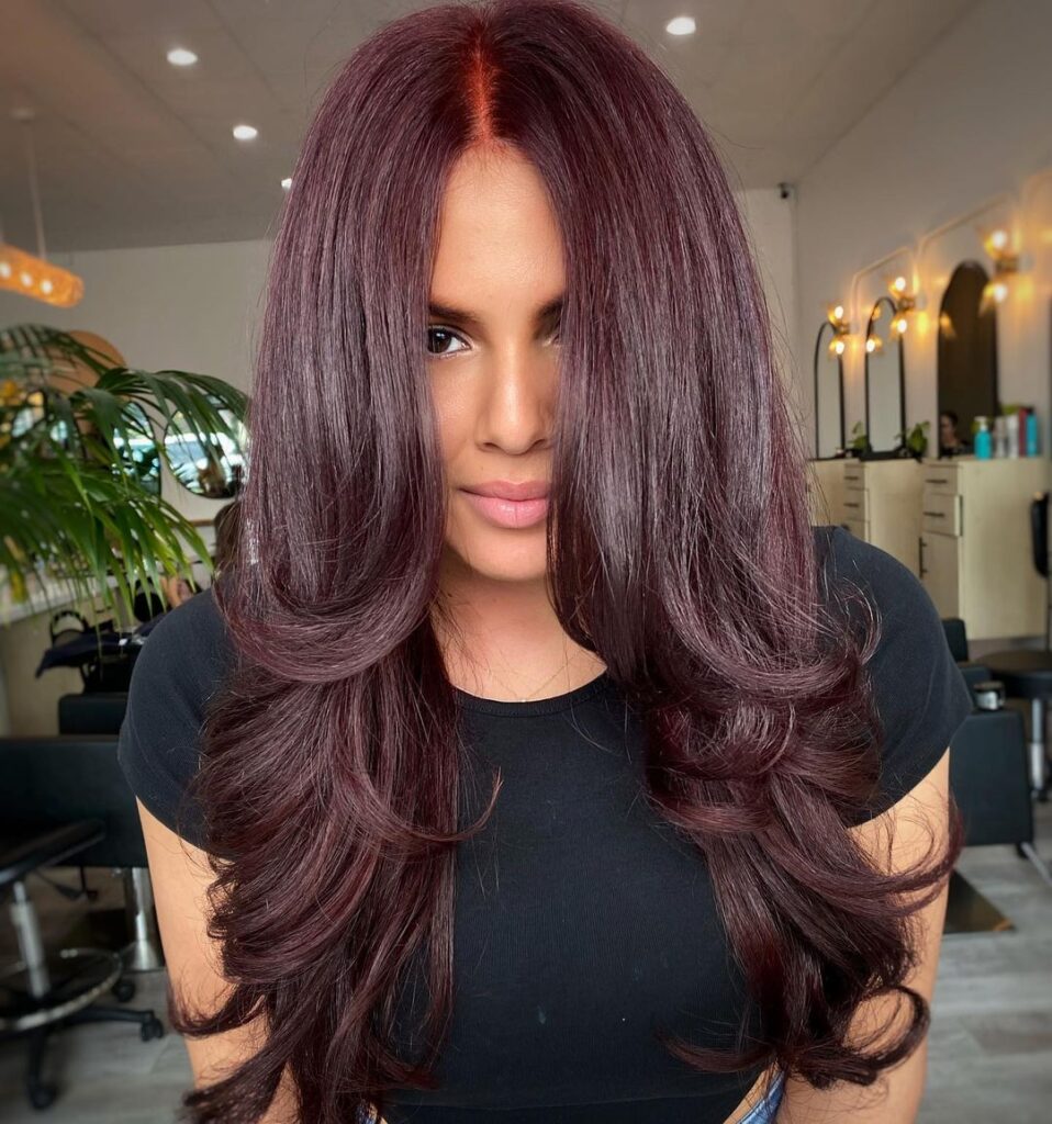 Long layered hair in deep burgundy