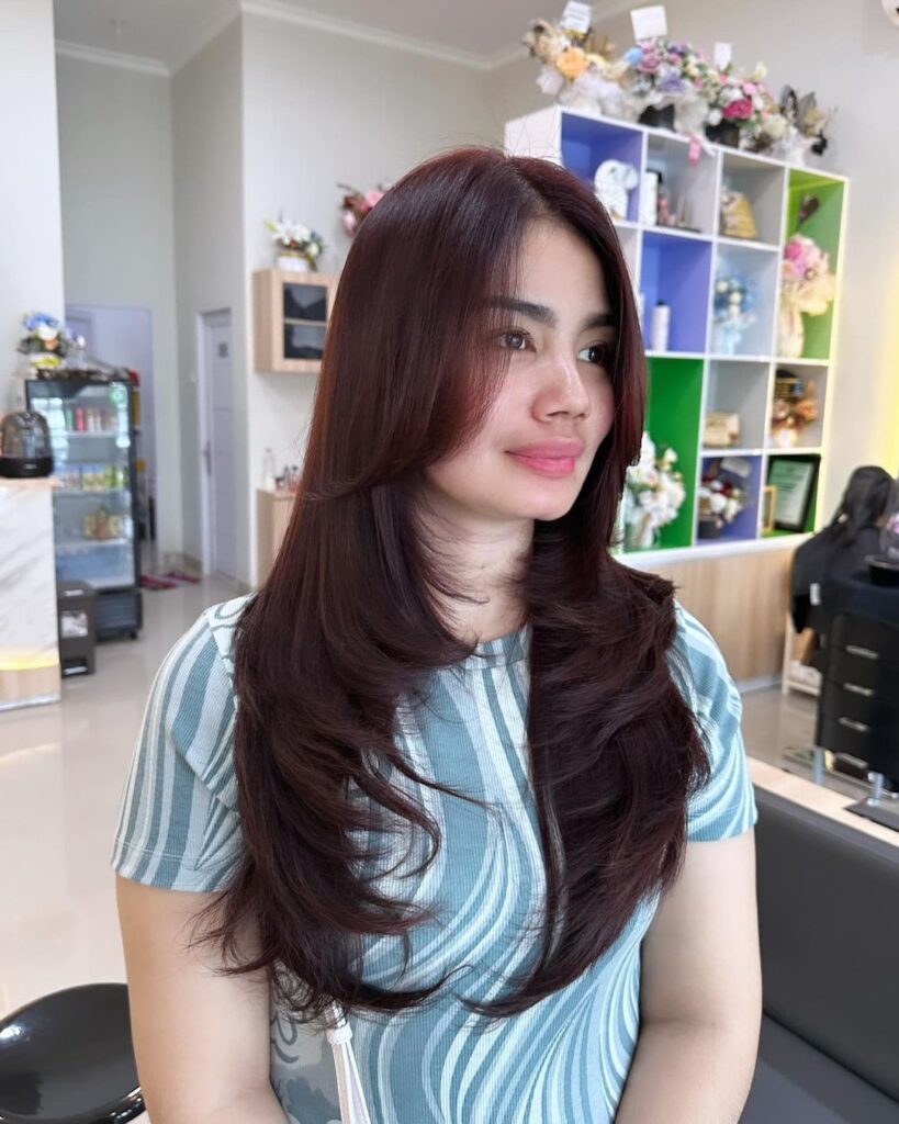 Layered brown hair with red tones