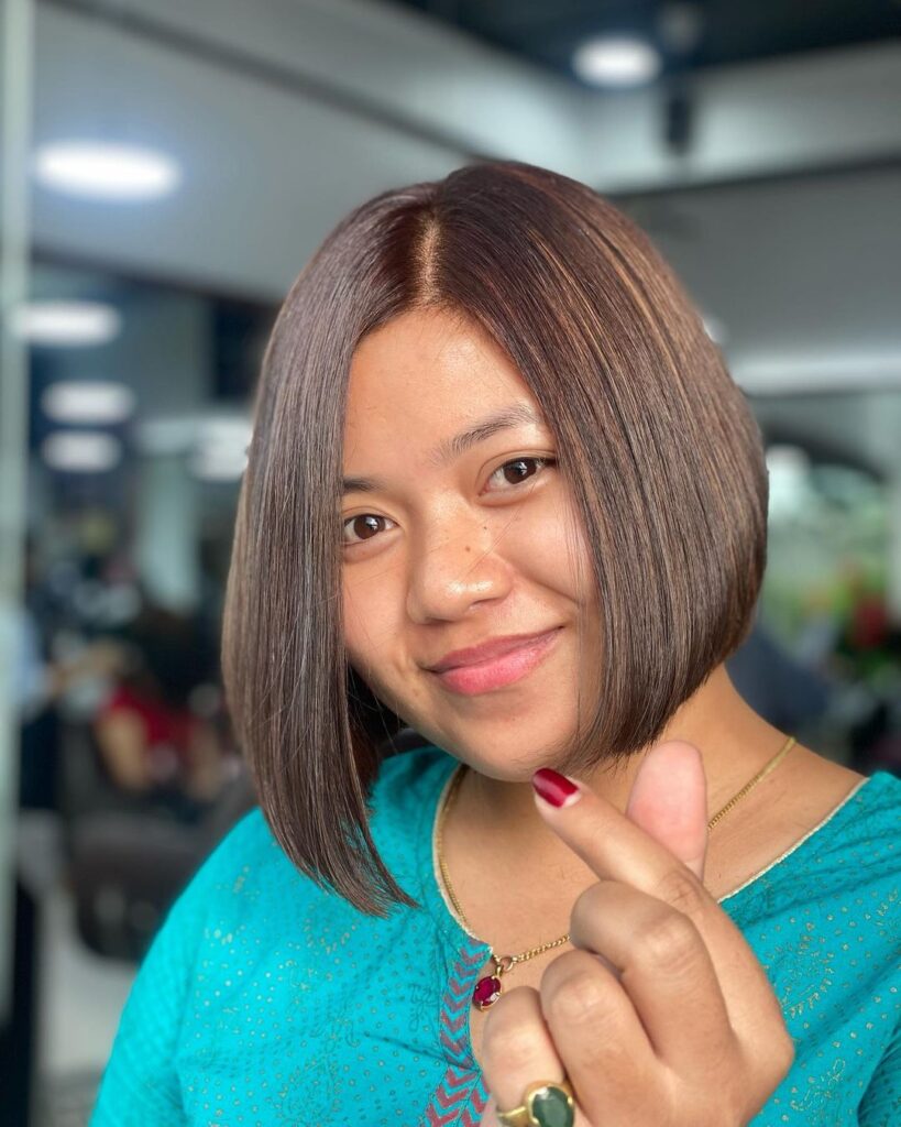 Short chocolate-colored hair in bob style