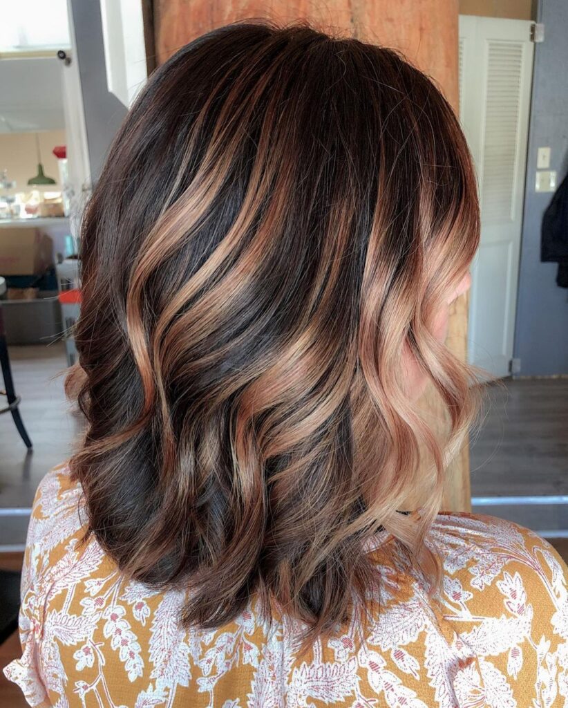 Dark brown hair with light streaks