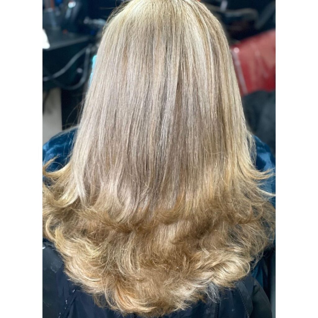 Blonde shoulder-length hair with choppy layers