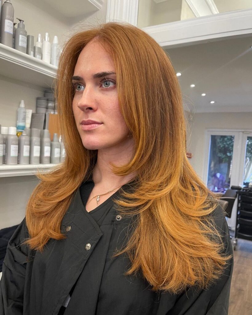 Layered hair with copper and blonde tones