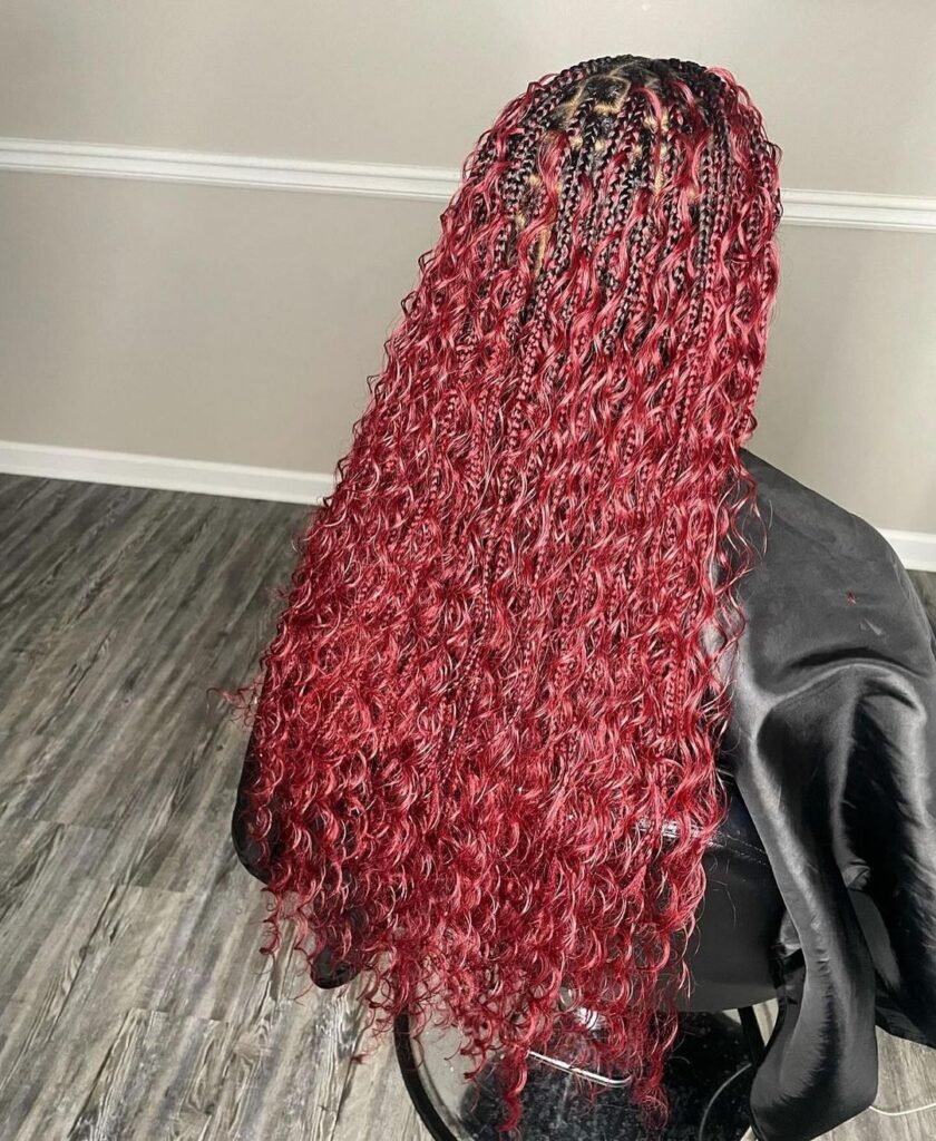 Box braids ending in loose curls