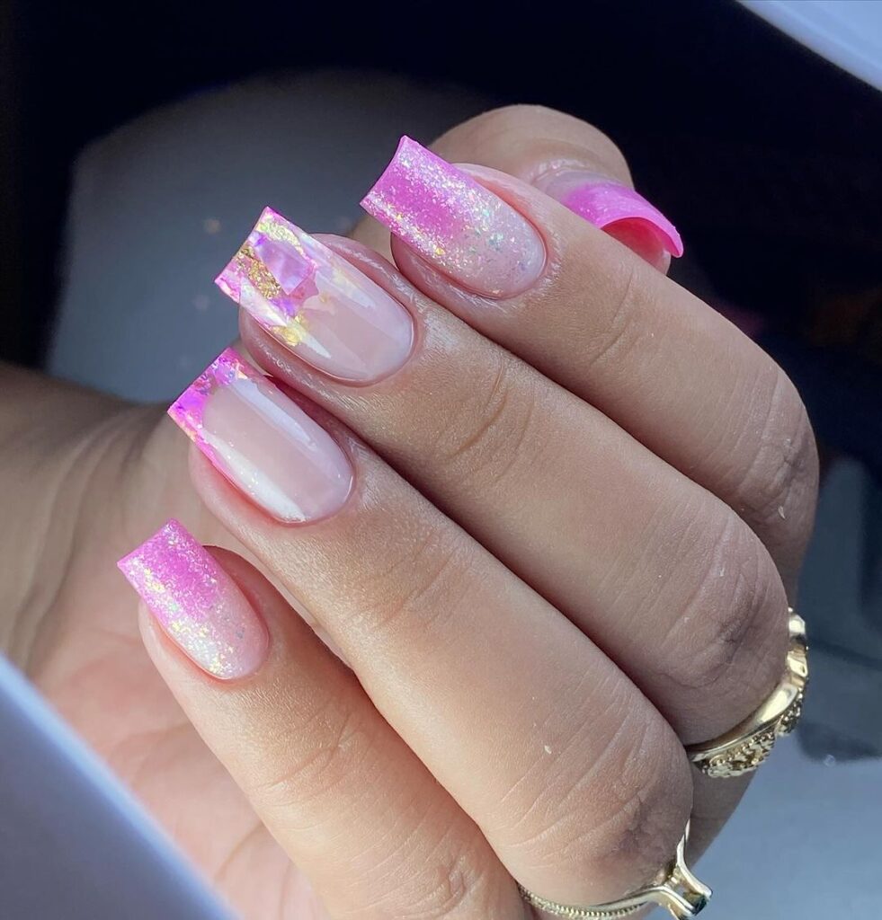 Pink square nails with golden glitter accents