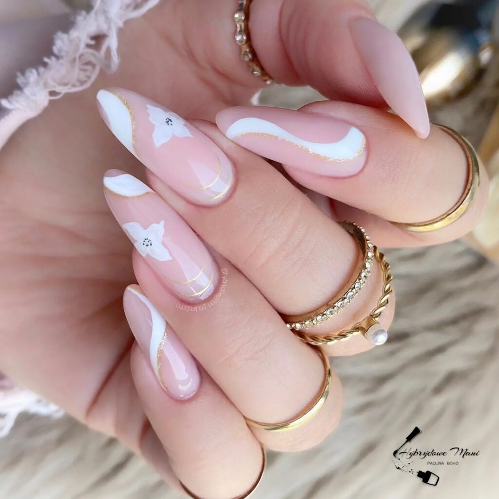 Long almond nails with pink pearl designs