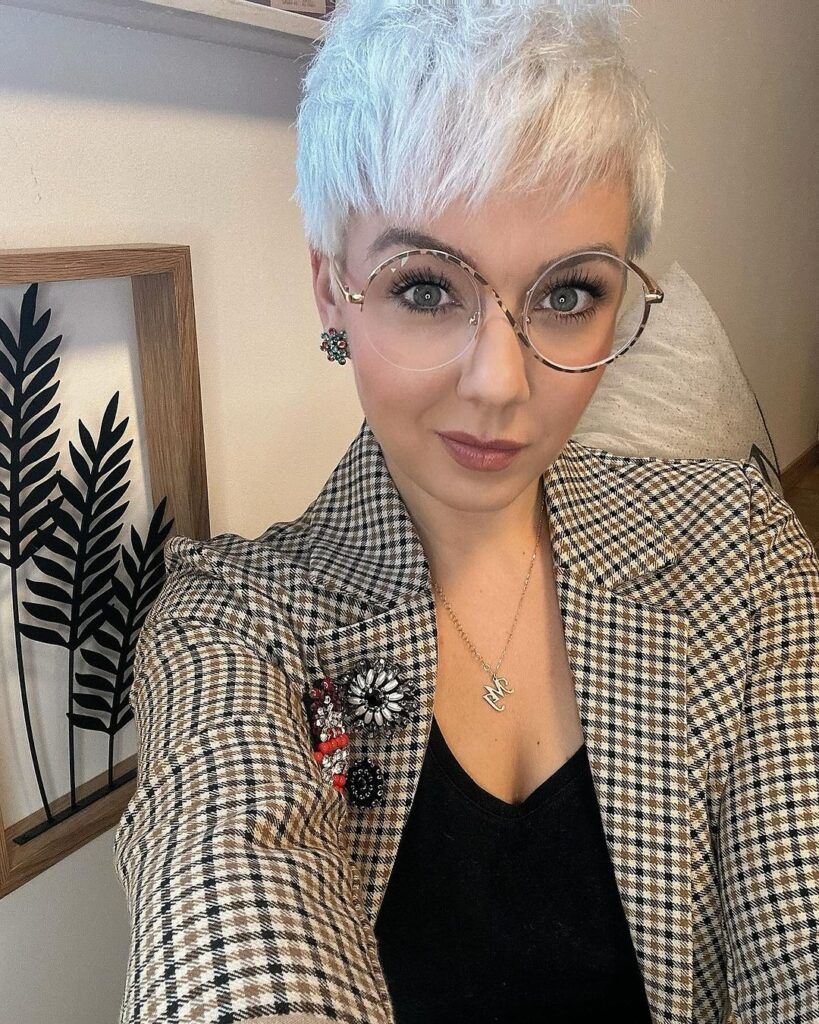 Short pixie, uneven bangs, frames glasses