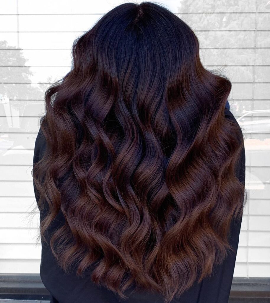 Layered brown hair with purple highlights