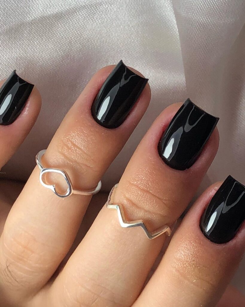 Black square nails with minimal gold accents