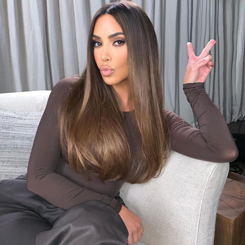 Sleek brown hair with smooth sidepart