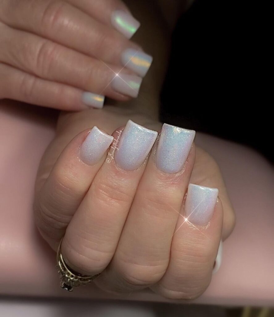 White nails with glittery tips, festive