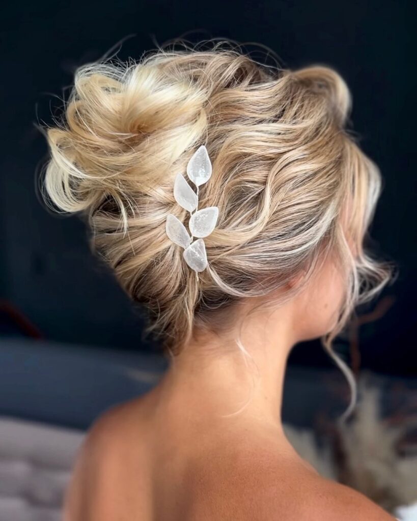 Voluminous French twist with sleek finish