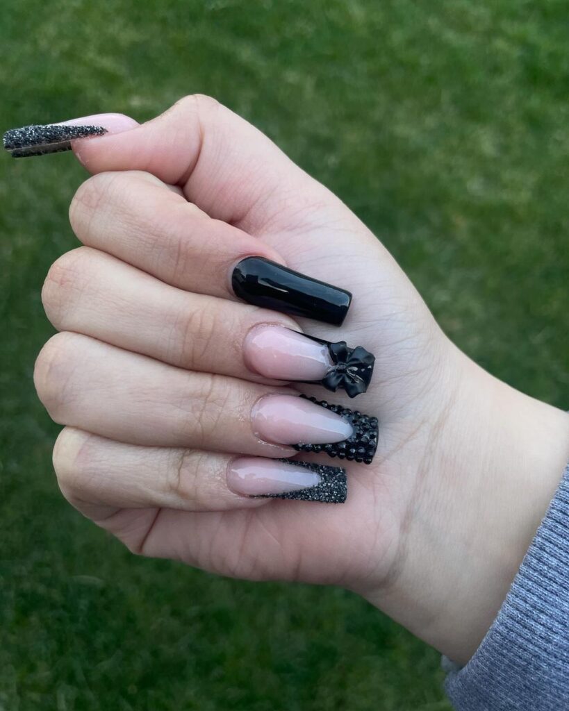 Black nails with glittery French tips