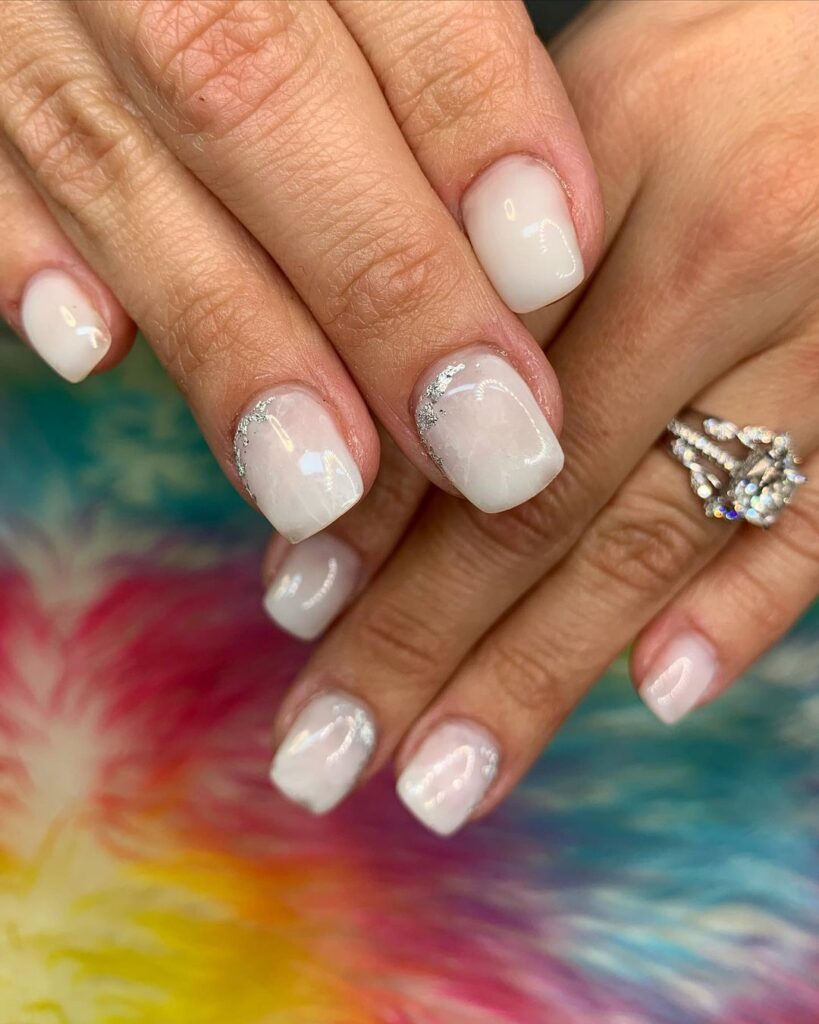 Bridal-inspired white nails with lace accents