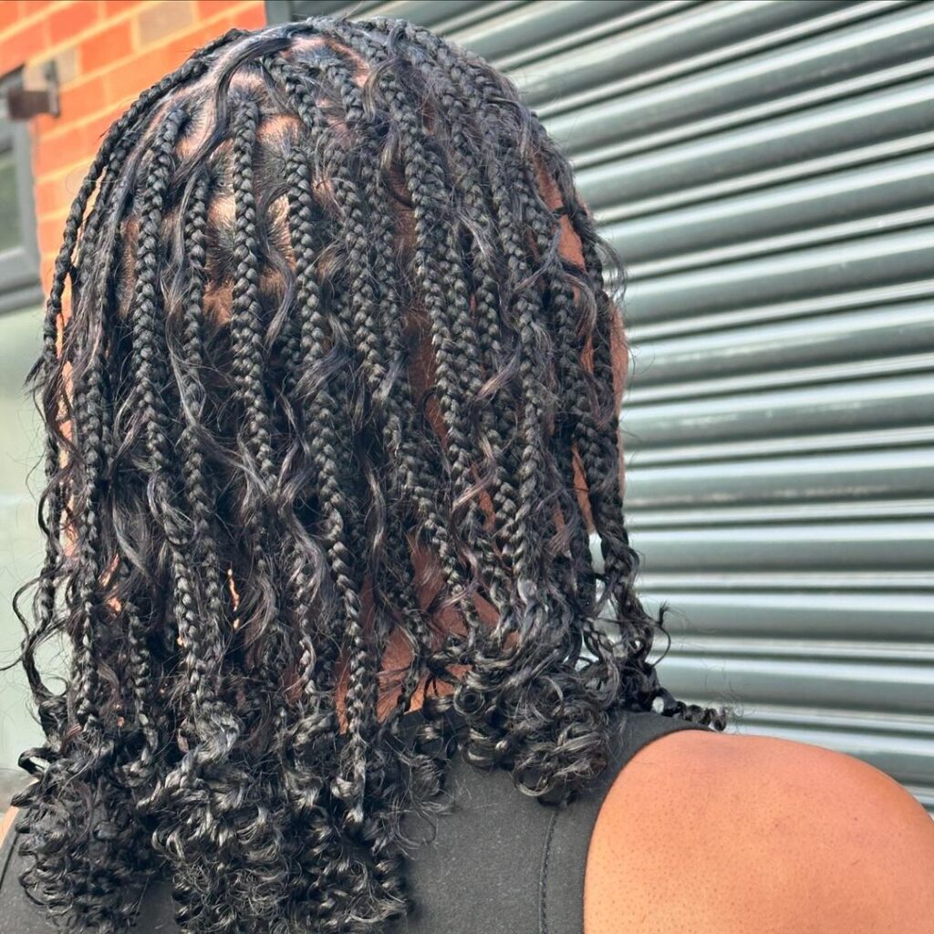 Knotless braids, curly ends, textured style