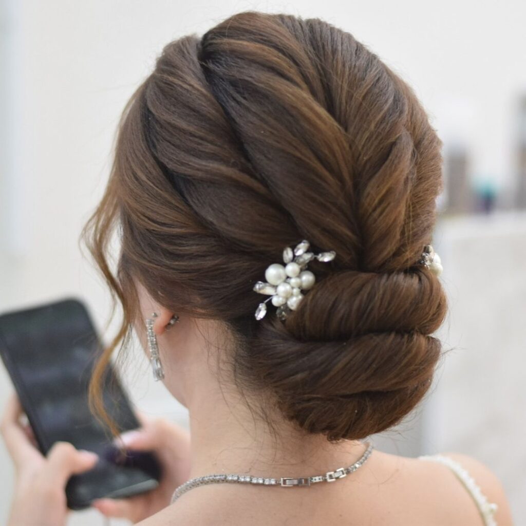 Twisted chignon, pearl accessory, formal updo