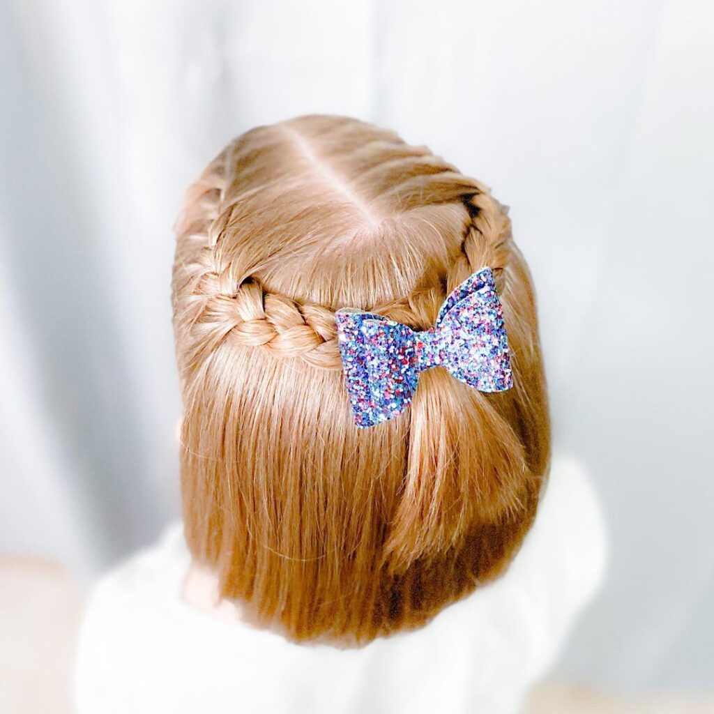 Side braid with glittery bow accessory