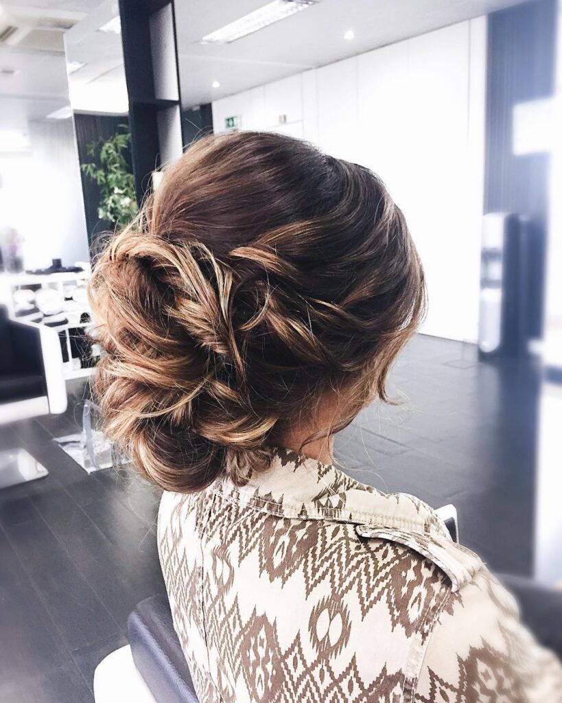 Textured low bun with twisted details