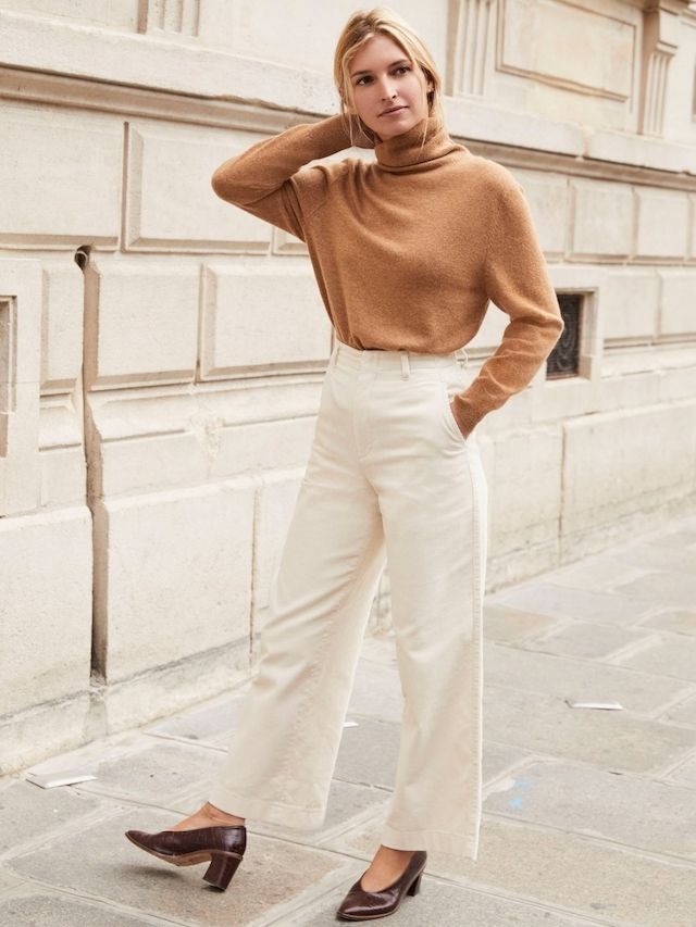 "Comfortable cable knit sweaters paired with wide-leg trousers for elegance."