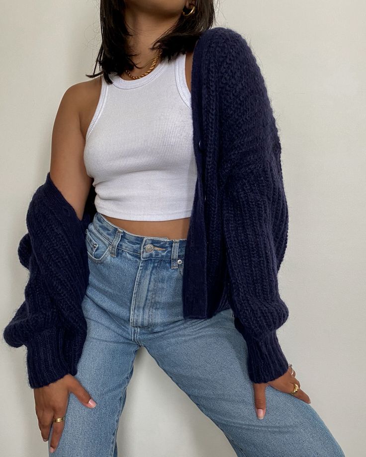 "Layered chunky cardigans over tank tops for extra warmth and style."