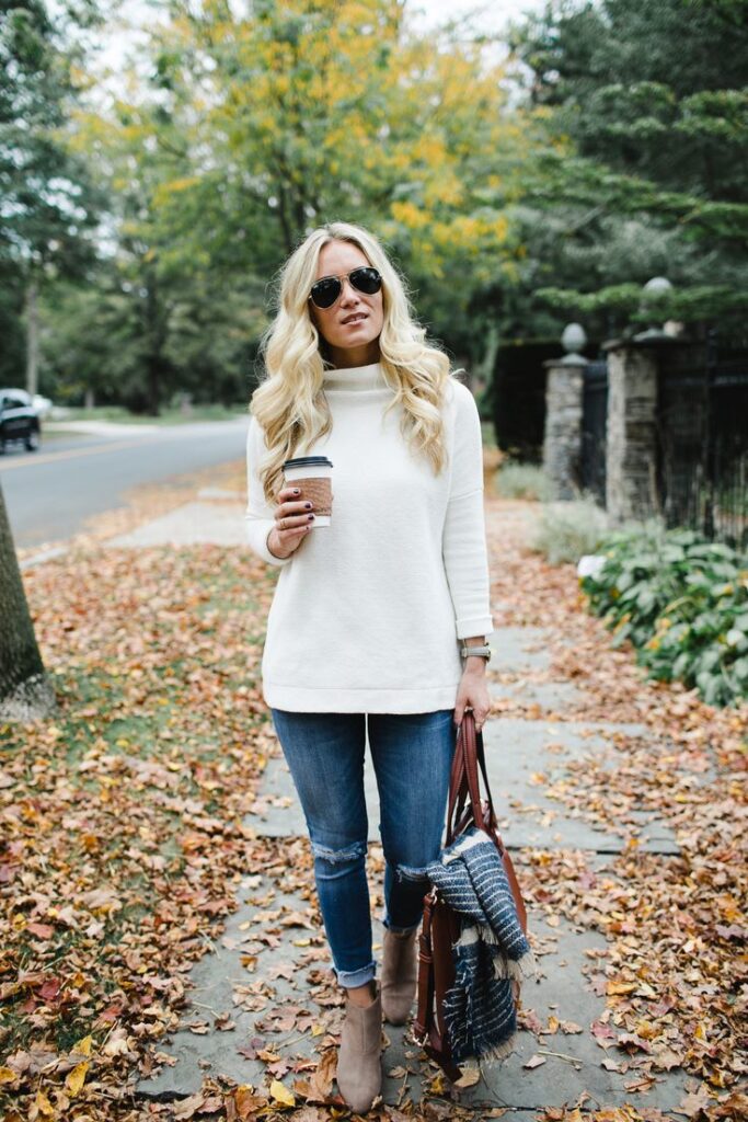 Cream sweaters styled with plaid accessories.