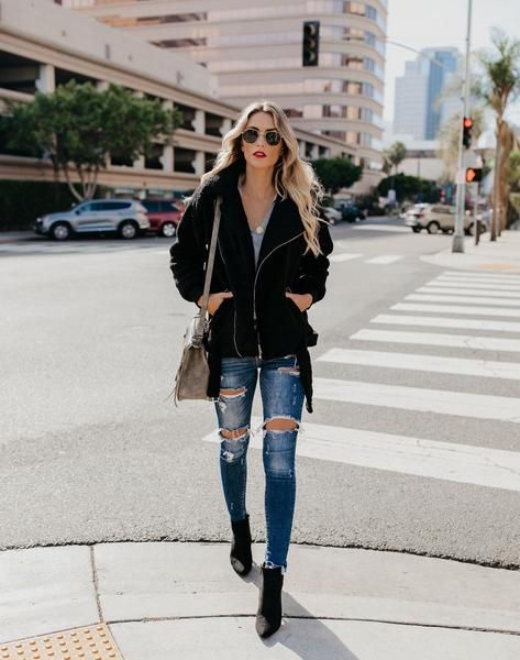 "Soft sherpa jackets layered over denim for warmth and style."