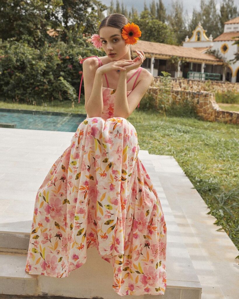 Floral dress brings lively charm.