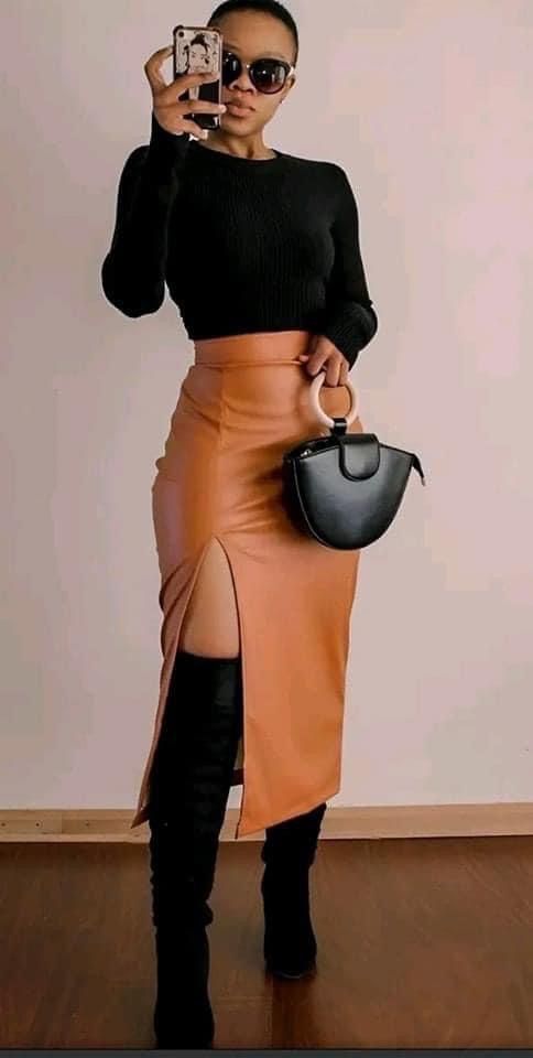 "Elegant fitted turtleneck matched with a midi skirt for a refined appearance."