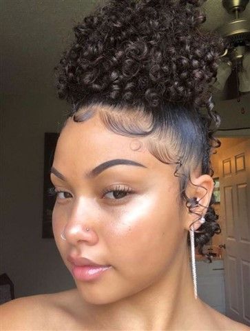 Chic high puff with baby hairs