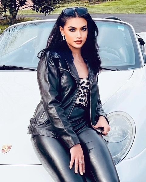 Edgy leather jacket over soft dress.