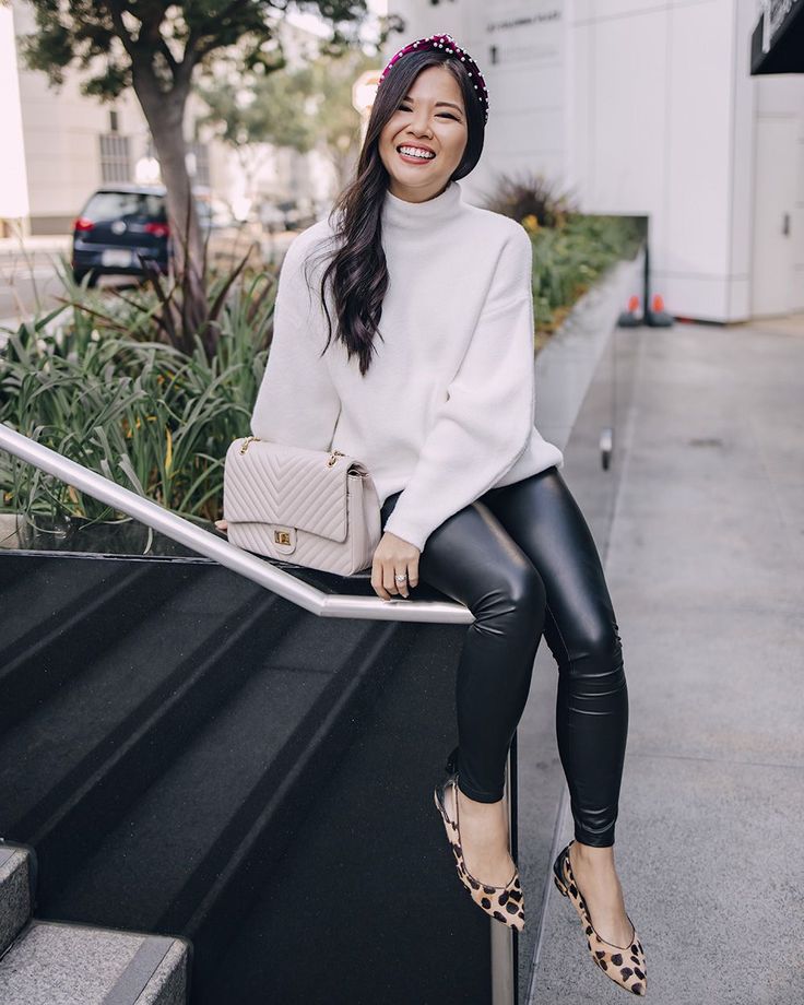 "Chic mock neck sweaters paired with leather leggings for a night out."