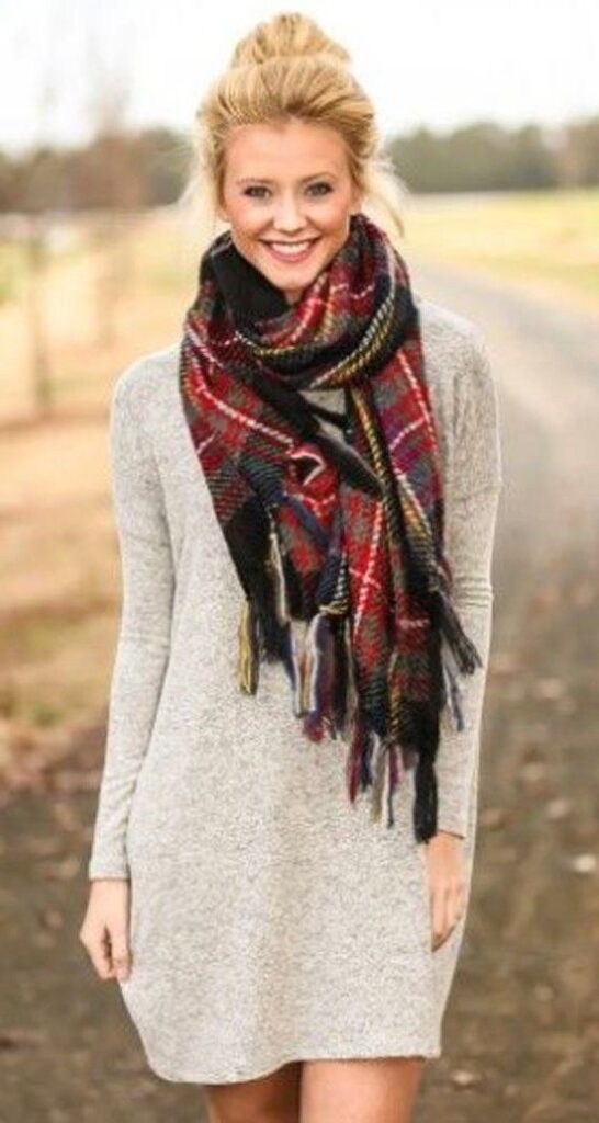 "Cozy plaid scarves adding flair to knit dresses for chilly days."