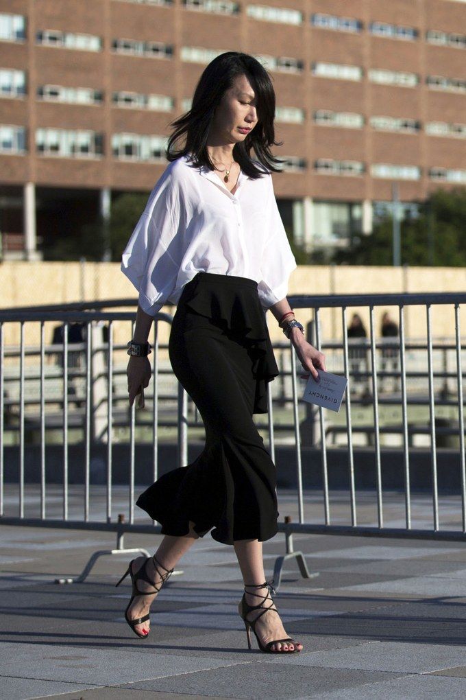 "Feminine ruffled tops paired with midi skirts for a stylish outfit."