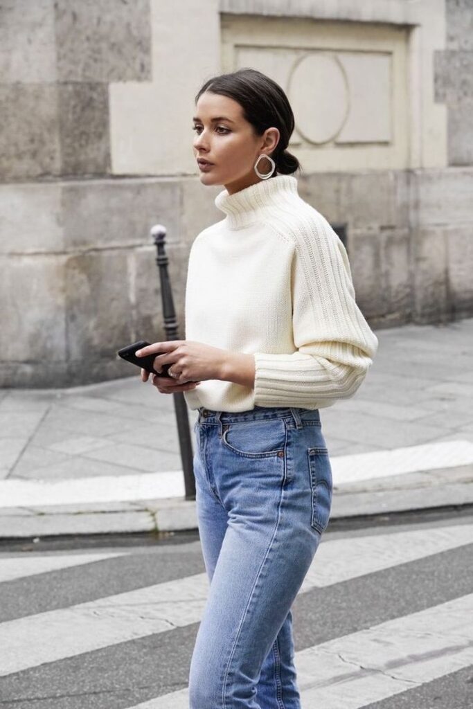 "Sleek turtleneck sweaters with high-waisted jeans for a polished look."