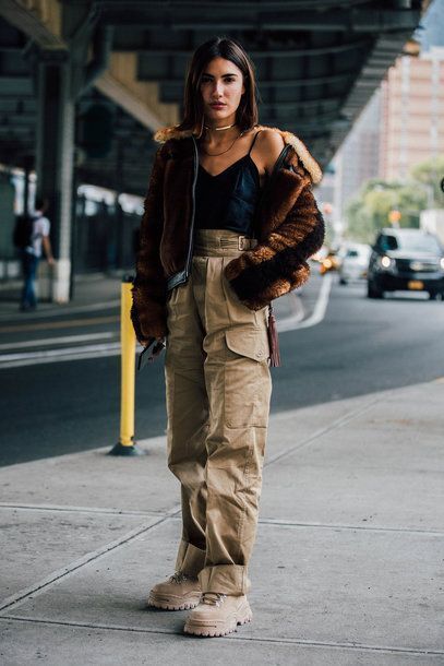 "Functional utility jacket matched with cargo pants for a stylish, practical outfit."