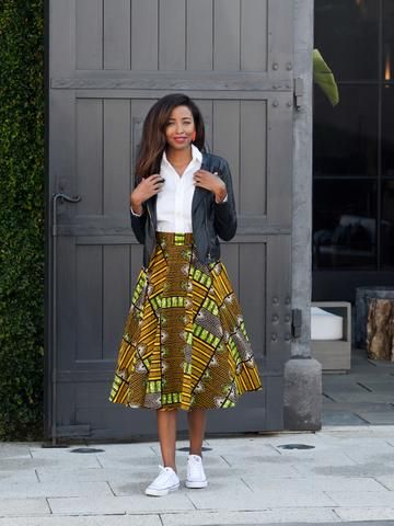 "Chic V-neck sweater styled with a pleated skirt for a polished appearance."