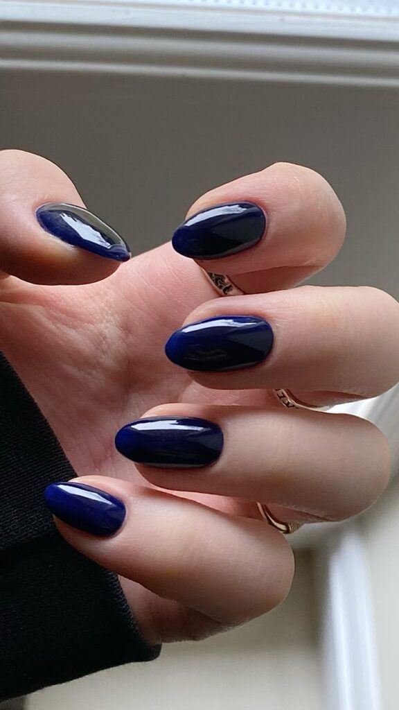 Dark navy almond nails, moody vibe
