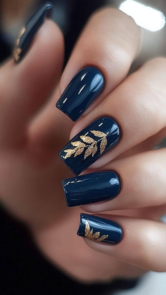 Deep blue nails with gold accents