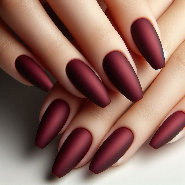 Matte burgundy almond nails, velvety look
